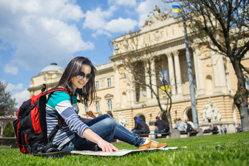 young happy attractive exchange student girl having fun in town