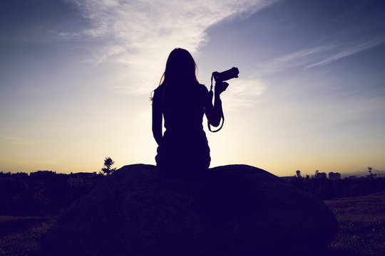 Slim female silhouette against the sky