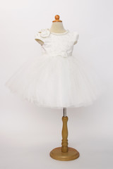 Baby white dress on a mannequin