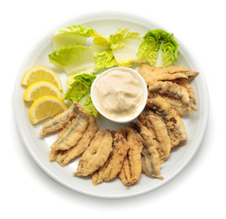 Fried anchovies with salad and mayonnaise