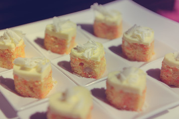 Carrot cake topping with coconut heart shapes