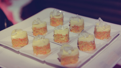 Carrot cake topping with coconut heart shapes