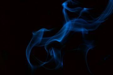 Blue smoke on black background