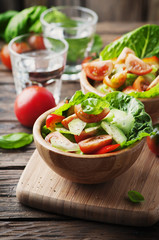 Concept of healthy food: salad with tomato and cucumber