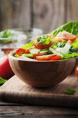 Concept of healthy food: salad with tomato and cucumber