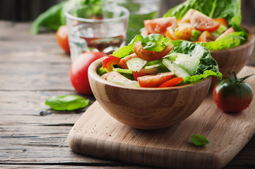 Concept of healthy food: salad with tomato and cucumber