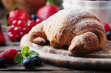 Fresh croissant with mix of berry