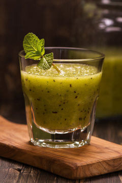Green refreshing smoothie with kiwi, cucumber and apple. Toned image. Selective focus