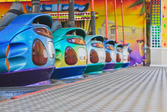 Bumper Cars in a row in amusement park