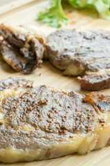 beefsteak on wood plate