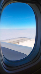 Fototapeta na wymiar airplane window with wing 