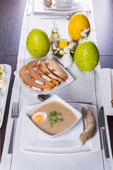 Easter traditional breakfast with white borsch soup, eggs and sausages