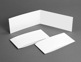 White empty closed card on grey to replace your design.