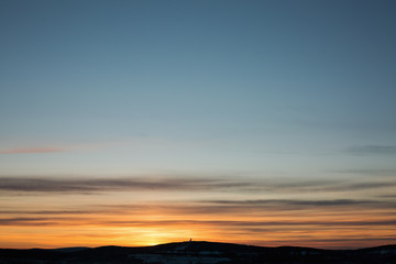 Colorful sunset in a winter day in Urals, Russia