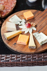 Wine appetizers set: meat and cheese selection, grapes and bread