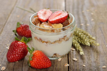 Natural yogurt with granola and strawberries