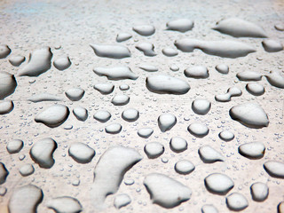 Fototapeta na wymiar water drops on metallic plate