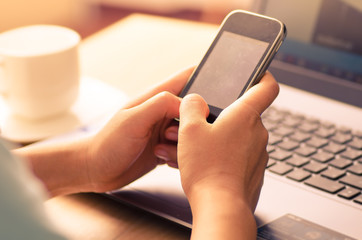 Woman using smart phone for working and internet