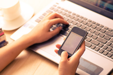 Woman using smart phone for working and internet