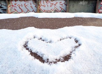 Heart-shape drawing on the snow