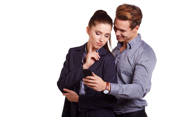 Business colleagues looking at mobile phone