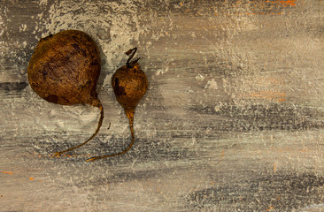 Fresh beets on a damp gray blue painted wooden background
