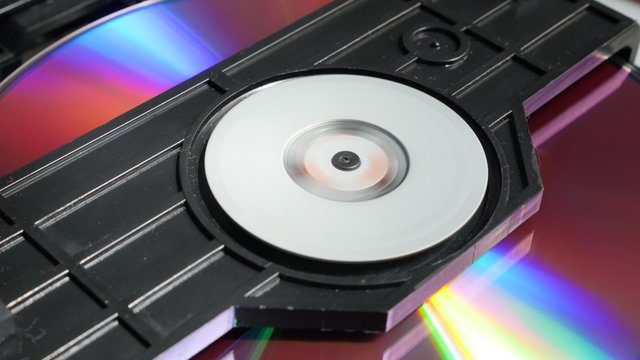 Compact disc  mechanism  playing media content 4K 2160p UltraHD footage - DVD and CD player disc reading  mechanism sequences 4K 3840X2160 UHD video