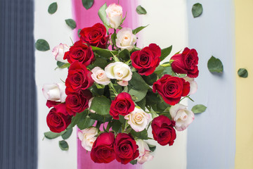 White and red roses with colorful painted background