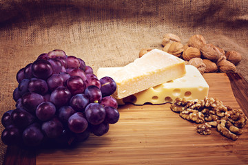platter with different types of cheese and nuts