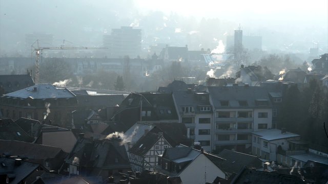Winter day in Germany with dust and smoking chimneys