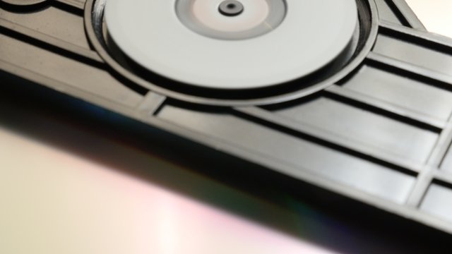 Compact disc reading mechanism fast rotating 4K 2160p UltraHD footage - DVD and CD player mechanism playing speed 4K 3840X2160 UHD video