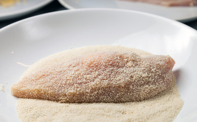 Fototapeta na wymiar Preparing chicken breast fillets, breadcrumbs and eggs