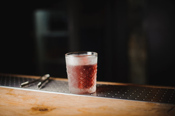 cocktail on a dark bar setting