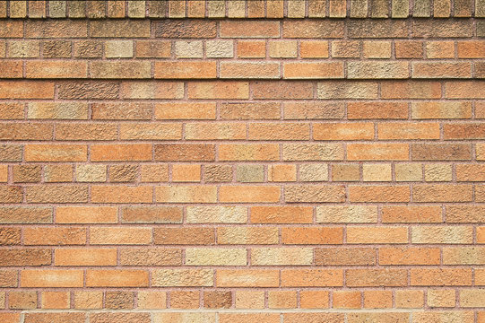 Old yellow brick wall background texture