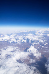 Fototapeta premium Blue sky background with tiny clouds