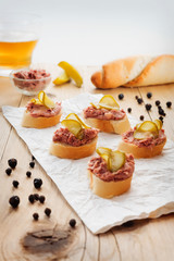 Fresh homemade fingerfood with pate and pickles