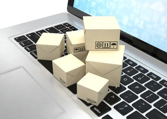 Technology business concept, shipping: cardboard package boxes on laptop