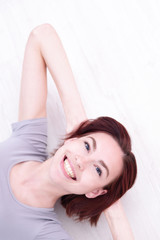 Obraz premium young happy woman lying