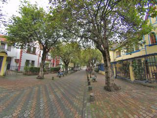 buildings, people, cars on the streets of the capital city of Qu