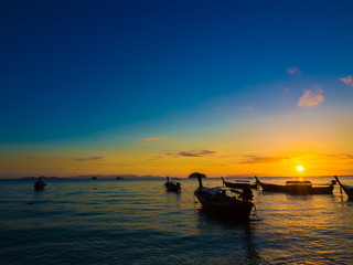 Boat on sea beach sunset