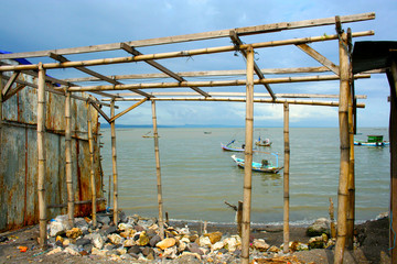 Fishing boats and pontoon on stilts in Indonesia