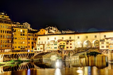 Fototapeta na wymiar Florence, Italy - The golden bridge in Florence at night.