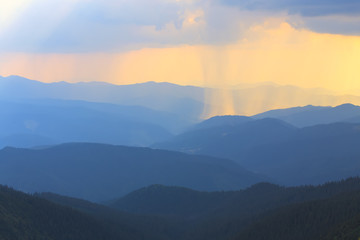 Fototapeta premium Summer rain in mountains.