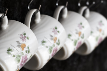 Tea cups on the kitchen wall