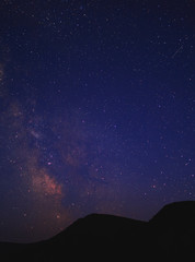 Fototapeta na wymiar Vibrant night sky, milky way in mountains.