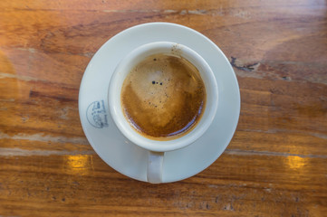 hot coffee and sunshine, blur wooden background