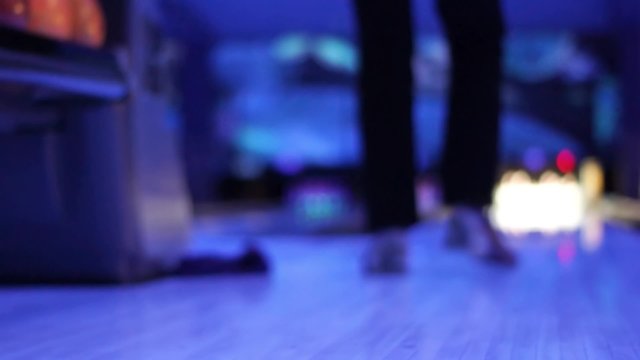 man throws ball in bowling