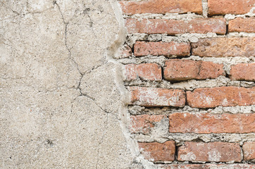 Cracked concrete ancient brick wall background