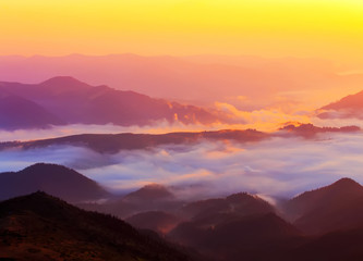Obraz na płótnie Canvas Beautiful scenic foggy mountain landscape.
