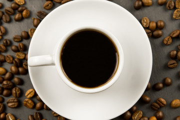 white black Cup of coffee on a black background.